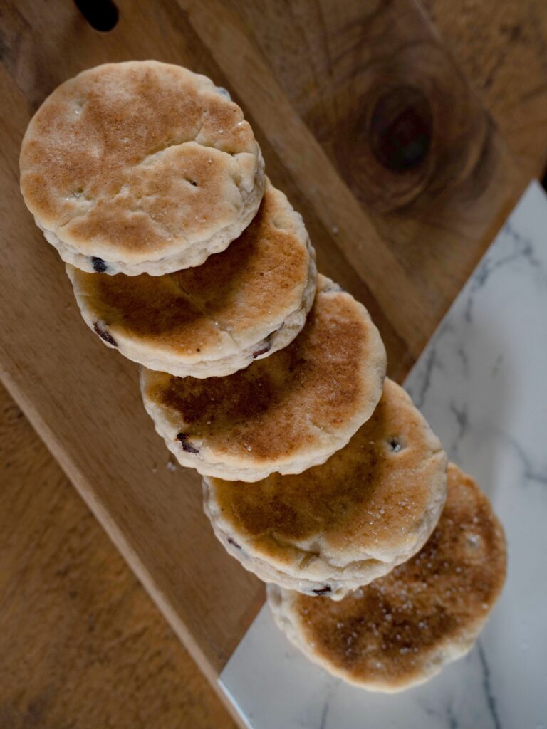 Five welsh cakes on marble and wood slab