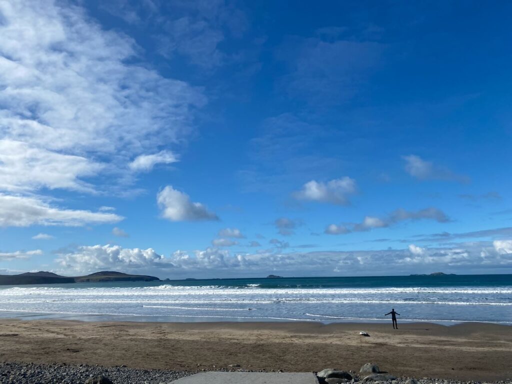 Wide sandy beach with waves of Whitesands Bay